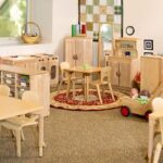 Large modern childcare center contrasted with a small home daycare setting, representing growing competition in Northern New York childcare services.