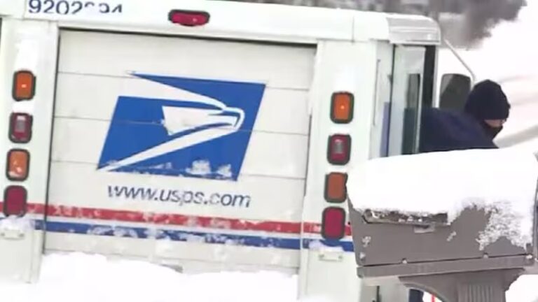USPS truck on a snowy rural road → screams Northern NY relevance