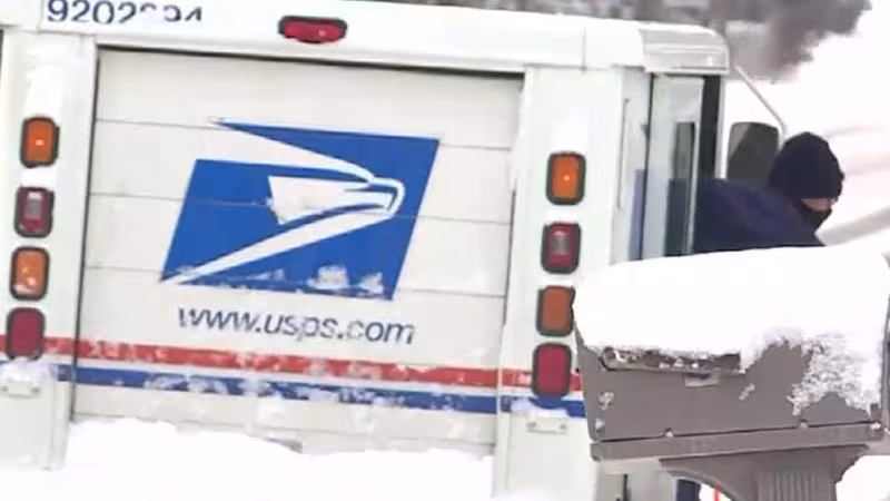 USPS truck on a snowy rural road → screams Northern NY relevance