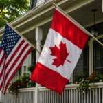A realistic front porch displaying the Canadian Maple Leaf and the American flag flying side by side in bright daylight, representing friendship, shared heritage, and a vision of North American unity.