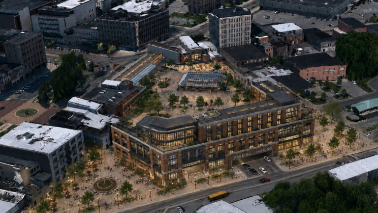 Aerial concept rendering of a modern mixed-use redevelopment in downtown Watertown, New York, showing a large brick-and-glass building surrounding an expansive public plaza with trees, seating, and walkways. The plaza extends around the east side of the building, while a roadway enters a ground-level parking garage integrated into the structure.