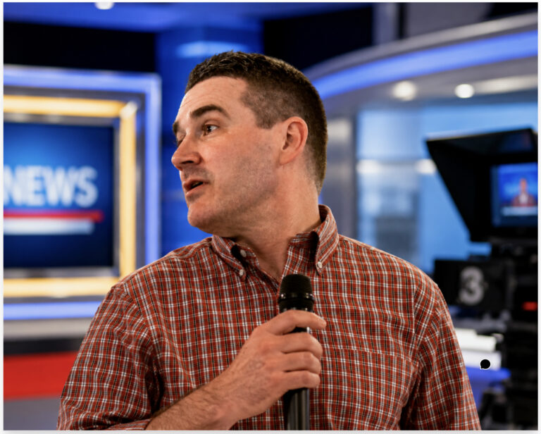 AI-Generated Image of Blake Gendebien in a Television News Studio
