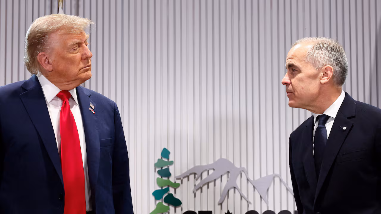 President Donald Trump speaks with Canadian Prime Minister Mark Carney during a meeting.