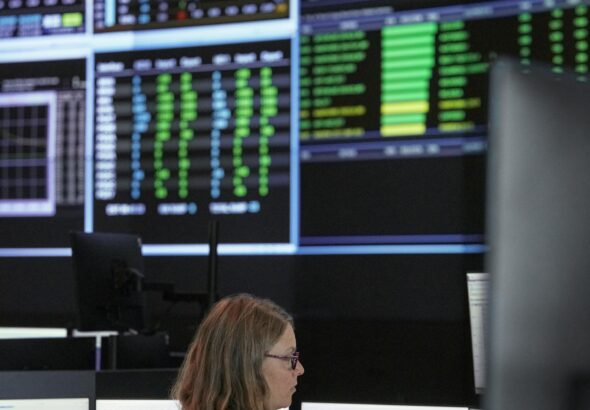 Control-room operators and monitoring screens at Ontario’s Independent Electricity System Operator.
