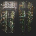 Stock photograph of server racks and network cabling; not the proposed Massena campus.