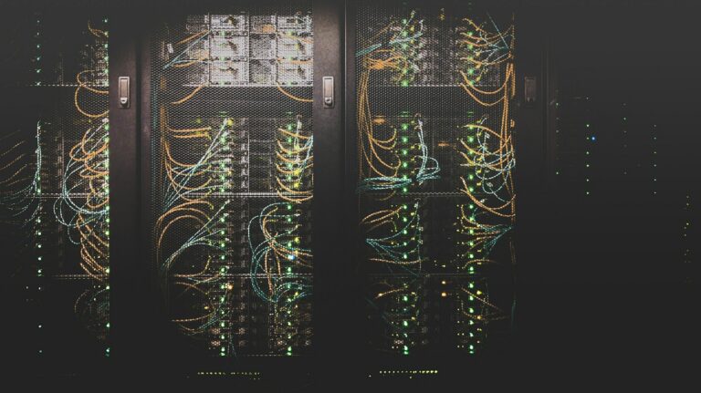 Stock photograph of server racks and network cabling; not the proposed Massena campus.