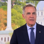 Digitally enhanced broadcast screen capture of Mark Carney speaking in a dark suit and blue tie, supplied by Hans Wilder / Digital Media USA.