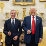 Mark Carney and Donald Trump smile and give thumbs-up while standing together in the Oval Office.
