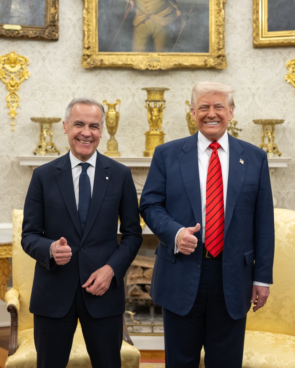 Mark Carney and Donald Trump smile and give thumbs-up while standing together in the Oval Office.